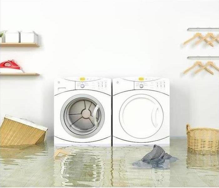 washer and dryer sitting in water